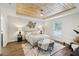 Bright main bedroom featuring a decorative wood ceiling, fan, and an area rug at 5 Pecan Drive Crse, Ocala, FL 34472