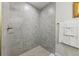 Beautifully tiled shower with bronze fixtures and a white towel set at 5 Pecan Drive Crse, Ocala, FL 34472