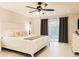 Comfortable main bedroom features a plush bed, ceiling fan, and sliding glass door to the outdoors at 5371 Lonesome Dove Dr, Kissimmee, FL 34746
