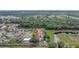 An aerial shot captures this home's location within a lush, established neighborhood with proximity to green spaces and amenities at 7 Madeira Ave, Orlando, FL 32825