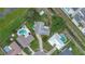Aerial view showcases a residential area with backyard pools and close proximity to commercial areas at 7 Madeira Ave, Orlando, FL 32825