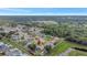 Overhead photo of property reveals community's setting amid mature trees, stormwater management, and easy access to surrounding areas at 7 Madeira Ave, Orlando, FL 32825