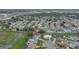 Aerial view showcases the home's location in a suburban neighborhood near parks and commercial areas at 7 Madeira Ave, Orlando, FL 32825