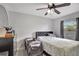 A stylish bedroom with wood-look floors and a ceiling fan at 7 Madeira Ave, Orlando, FL 32825