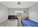 A charming bedroom features two beds with a window view at 7 Madeira Ave, Orlando, FL 32825