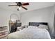A modern bedroom features a ceiling fan and wood-look floors at 7 Madeira Ave, Orlando, FL 32825
