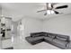 Spacious living room with marble floors, gray walls, a ceiling fan, and an open concept design at 7 Madeira Ave, Orlando, FL 32825