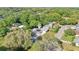 Aerial view of a charming neighborhood with tree-lined streets and well-maintained homes surrounded by lush greenery at 7301 Armstrong Rd, Orlando, FL 32810