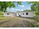 Expansive backyard with a patio area and lush greenery, perfect for outdoor relaxation at 7301 Armstrong Rd, Orlando, FL 32810