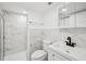 Updated bathroom featuring modern fixtures, and white marble-style tile in the shower and vanity areas at 7301 Armstrong Rd, Orlando, FL 32810