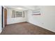 Well-lit bedroom featuring a window with views and carpeted flooring at 7301 Armstrong Rd, Orlando, FL 32810