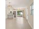 Dining room with decorative lighting, tile floors, and sliding doors leading to the backyard at 7301 Armstrong Rd, Orlando, FL 32810