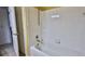 Shower with white tile and metal fixtures, and a shower head at 830 Airport Rd # 115, Port Orange, FL 32128