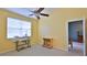 Bright bedroom featuring a window and doorways leading to other rooms at 830 Airport Rd # 115, Port Orange, FL 32128