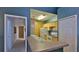 Open kitchen design with a breakfast bar, ample counter space and bright cabinets at 830 Airport Rd # 115, Port Orange, FL 32128
