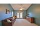 Inviting living room featuring carpeted floors, neutral walls, and a cozy brown sofa at 830 Airport Rd # 115, Port Orange, FL 32128