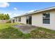 Backyard features a concrete patio, some weeds, and a partial fence at 831 Lindley Blvd, Deland, FL 32724