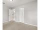 Bedroom with neutral carpet, closet, and a doorway leading to the bathroom at 831 Lindley Blvd, Deland, FL 32724