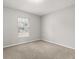 Bedroom showcasing natural light from a window with neutral wall paint at 831 Lindley Blvd, Deland, FL 32724