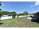 Spacious backyard features a lush lawn with a privacy fence and mature trees at 8625 Shady Glen Dr, Orlando, FL 32819