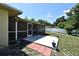 Home's large screened-in patio offers a seamless transition to the expansive backyard at 8625 Shady Glen Dr, Orlando, FL 32819