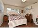 Bedroom featuring wood floors, a window, and neutral decor at 8625 Shady Glen Dr, Orlando, FL 32819