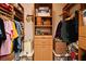 Spacious walk-in closet with custom wood shelving and drawers, providing ample storage and organization at 8625 Shady Glen Dr, Orlando, FL 32819