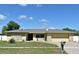 Charming single-story home featuring a stone facade and manicured lawn in a quiet neighborhood at 8625 Shady Glen Dr, Orlando, FL 32819