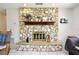 Rustic stone fireplace with a wooden mantel, adding warmth and character to the home at 8625 Shady Glen Dr, Orlando, FL 32819