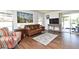 Bright living room featuring wood floors, neutral paint, and outdoor access at 8625 Shady Glen Dr, Orlando, FL 32819