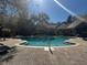 The community pool features a brick pool deck, a well-maintained exterior, and comfortable lounge seating at 8801 Villa View Cir # 207, Orlando, FL 32821