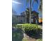 A beautiful exterior of a two story condo with private balconies and landscaped front yard at 8801 Villa View Cir # 207, Orlando, FL 32821
