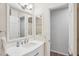 Bright bathroom with white vanity and large mirror at 921 Torchwood Dr, Deland, FL 32724