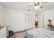 Bright bedroom boasts wood floors and a double-door closet, creating a calm and cozy space at 921 Torchwood Dr, Deland, FL 32724