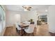Formal dining room with wood floors, natural light and a view into the living room at 921 Torchwood Dr, Deland, FL 32724