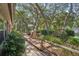 Inviting exterior featuring a charming walkway and lush landscaping at 921 Torchwood Dr, Deland, FL 32724
