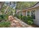 Inviting exterior featuring a charming walkway and lush landscaping at 921 Torchwood Dr, Deland, FL 32724