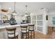 Stylish kitchen featuring blue cabinets, stainless steel appliances, and a cozy breakfast bar at 921 Torchwood Dr, Deland, FL 32724