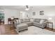 Inviting living room with a comfortable gray sectional sofa and neutral decor at 921 Torchwood Dr, Deland, FL 32724