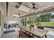 Large covered patio with outdoor seating and dining areas provides an inviting space for entertainment and relaxation at 921 Torchwood Dr, Deland, FL 32724