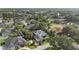 A stunning aerial view of a home with beautiful landscaping in a quiet neighborhood, showcasing the area's charm at 968 Ashton Oaks Cir, Lakeland, FL 33813
