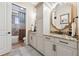 Bathroom with modern fixtures and finishes, featuring a granite countertop vanity and a walk-in shower at 968 Ashton Oaks Cir, Lakeland, FL 33813