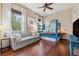 Cozy bedroom featuring a unique blue bunk bed, a comfortable sofa, and natural light at 968 Ashton Oaks Cir, Lakeland, FL 33813