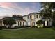 Stunning two-story home featuring lush landscaping and elegant architectural details at 968 Ashton Oaks Cir, Lakeland, FL 33813
