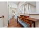 Hallway with hardwood floors and decorative nautical accents displayed on a wooden console table at 968 Ashton Oaks Cir, Lakeland, FL 33813