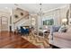 Cozy living room with hardwood floors, natural light, stylish decor, and comfortable seating at 968 Ashton Oaks Cir, Lakeland, FL 33813