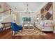 Inviting living room with hardwood floors, modern chandelier, and comfortable seating arrangement at 968 Ashton Oaks Cir, Lakeland, FL 33813