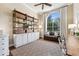 Cozy office with built-in shelving, natural light, and a comfortable seating area at 968 Ashton Oaks Cir, Lakeland, FL 33813