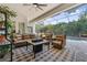 Relaxing screened patio with a cozy seating area, stylish rug, and a beautiful view of the pool and backyard at 968 Ashton Oaks Cir, Lakeland, FL 33813
