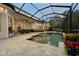 A stunning screened-in pool area with pavers, offering ample seating and a relaxing retreat at 968 Ashton Oaks Cir, Lakeland, FL 33813